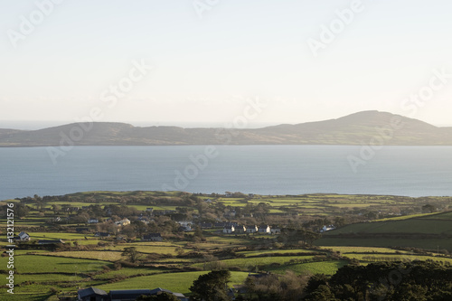 Sheeps Head Peninsula County Cork Ireland looking across Dunmanus Bay to the Mizen Peninsula with Kilcrohane village in the foreground photo