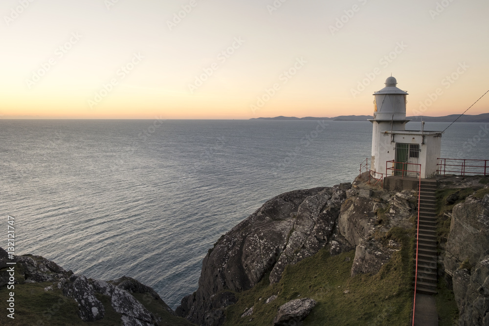 The lighthouse at sunset on the Sheeps Head Peninsula County Cork Ireland