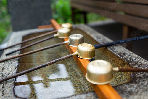 Japanes wooden ladle in shrine photo
