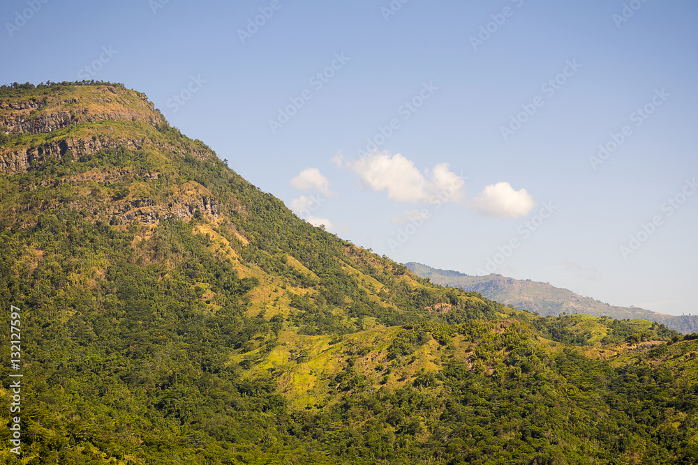 beautiful green mountains/Hills with blue sky background. Winter landscape season in asia Thailand. beautiful green mountains/Hills with blue sky background. Winter landscape season in asia Thailand.