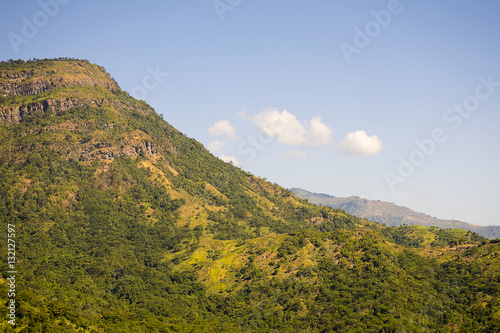 beautiful green mountains/Hills with blue sky background. Winter landscape season in asia Thailand. © sky1991