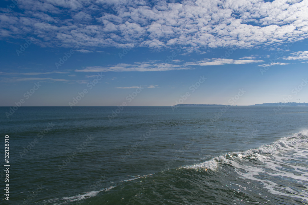 Snowy beach and sea at winter with blue sky Snowy beach and sea at winter with blue sky