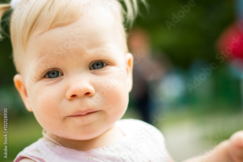 Small cute baby outdoors in the park