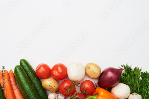 Overhead shot of fresh vegetables lying on flat layout with a co