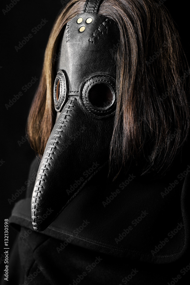 a masked man plague doctor