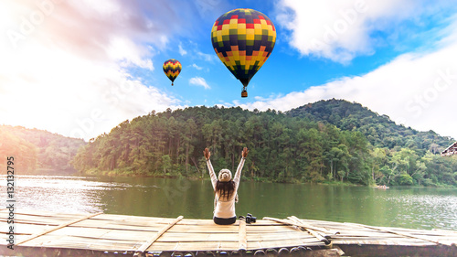 Women are siting on the terrace at resort on enjoy with the outside nature.Small Camping Tent Illuminated Inside., Pang Ung, Mae Hong Son, Northen Thailand