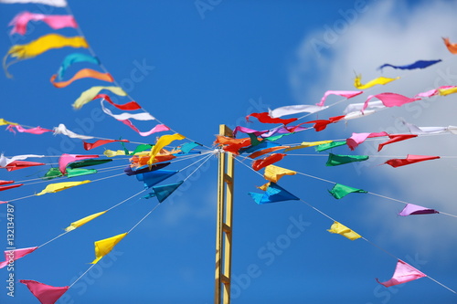 Flags and streamers of various colors. When the wind blows flick And a bright blue sky background