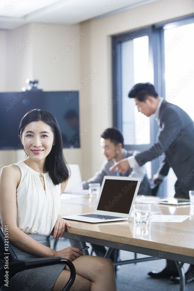 Confident businesswoman in meeting room Confident businesswoman in meeting room