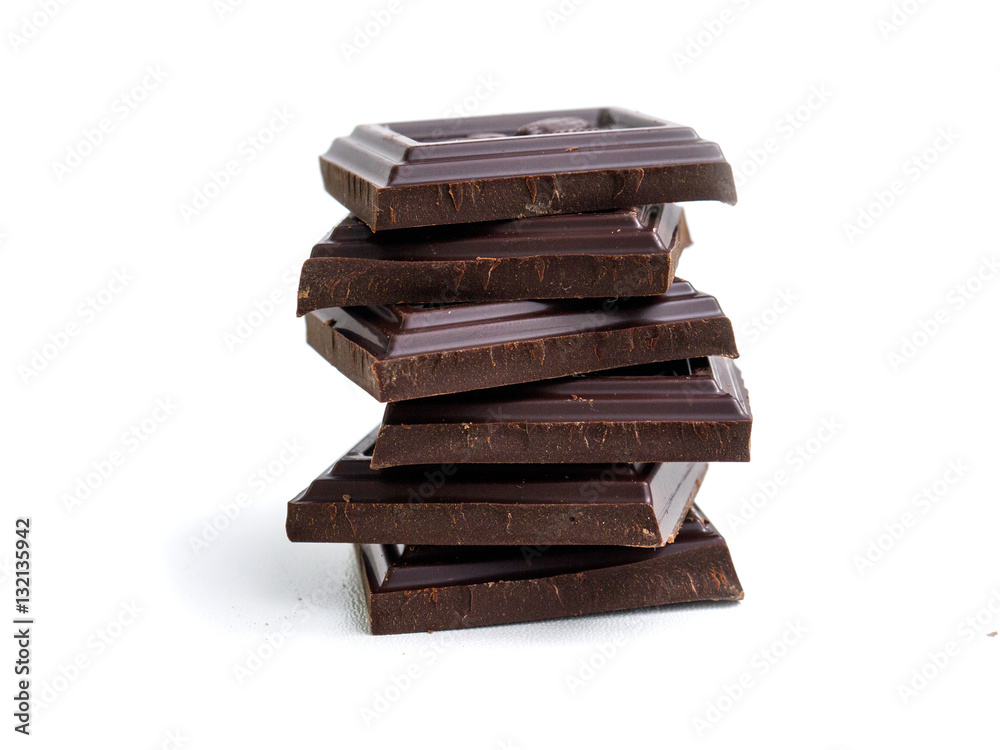 broken bar of dark chocolate on isolated white background broken bar of dark chocolate on isolated white background