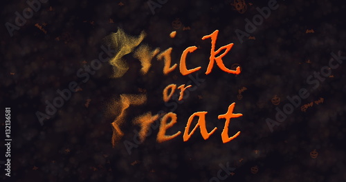 Trick or Treat text dissolving into dust to left