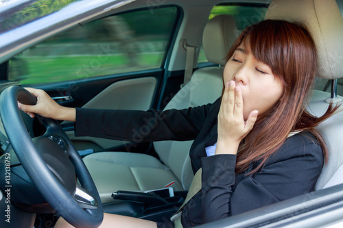 Closeup portrait sleepy, tired, close eyes young woman driving © petzshadow