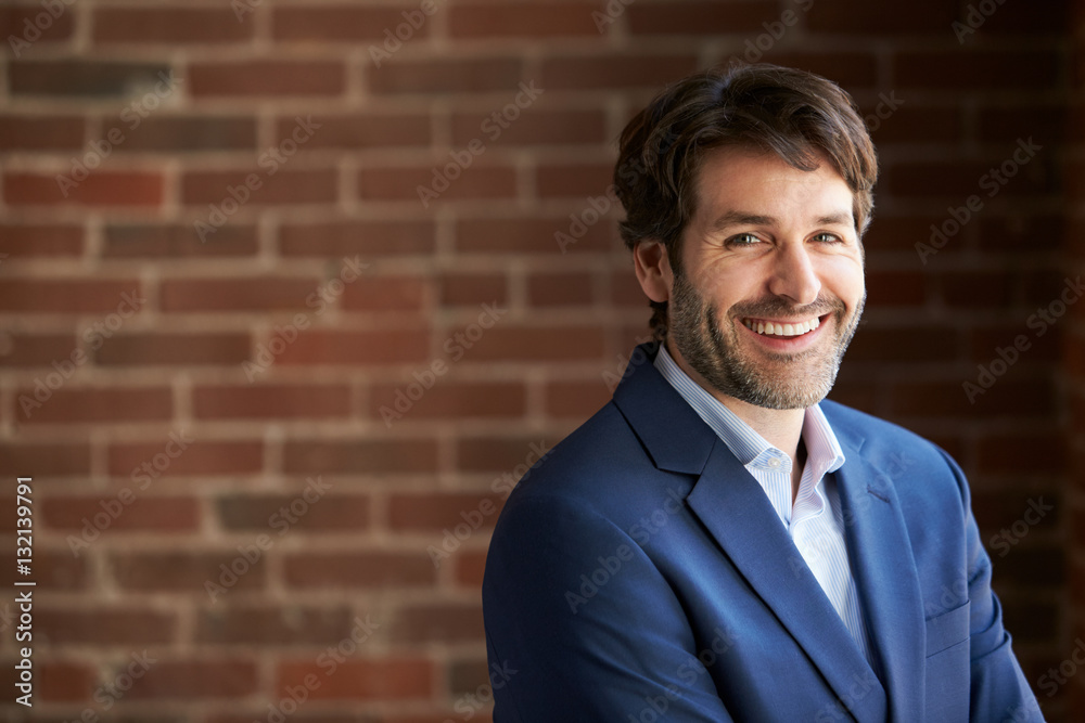 Head And Shoulders Portrait Of Businessman In Office Head And Shoulders Portrait Of Businessman In Office