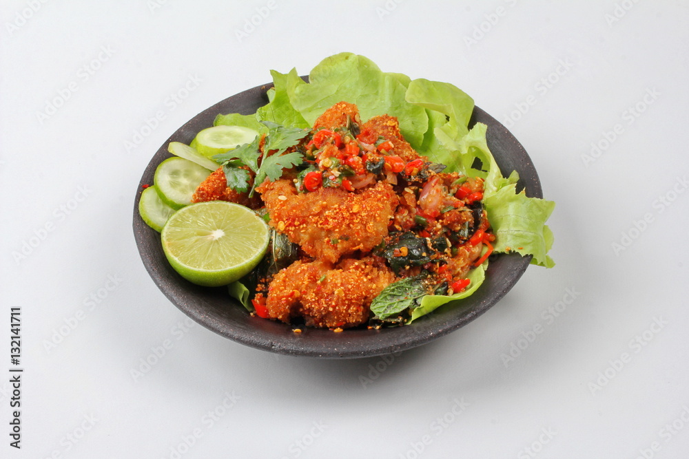 Spicy sour fried chicken salad call Yum Kai Zap - Thai. Spicy sour fried chicken salad call Yum Kai Zap - Thai.