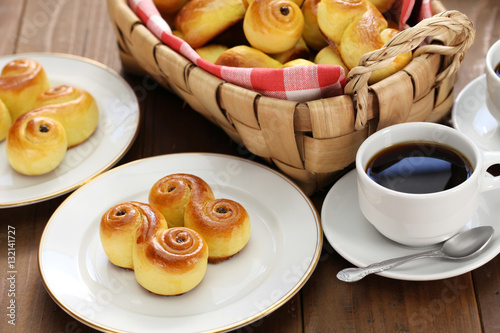 homemade swedish saffron buns, lussekatt in basket photo