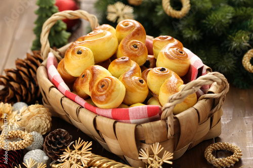 homemade swedish saffron buns, lussekatt in basket photo