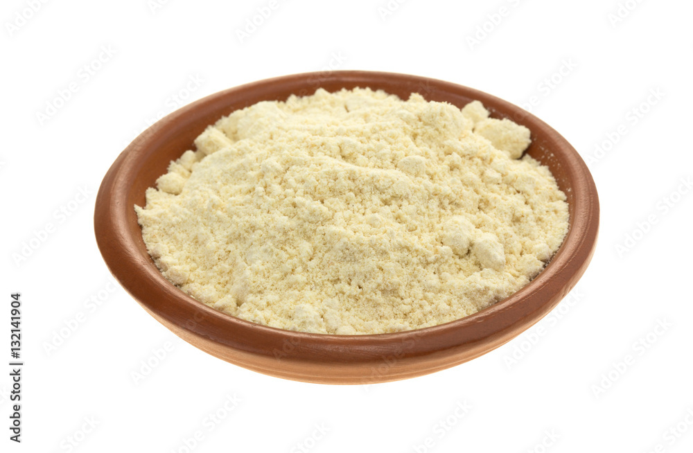 Soy powder in a small bowl on a white background. Soy powder in a small bowl on a white background.