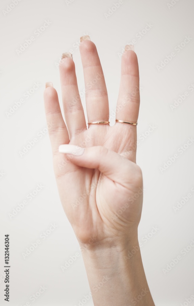 hand showing the number 4