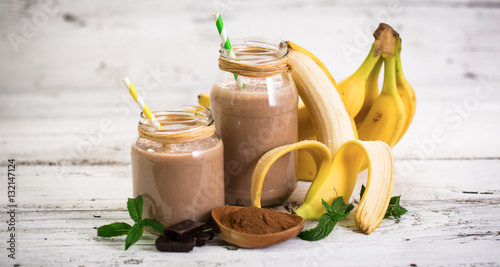 Banana and chocolate smoothie in the glass jar