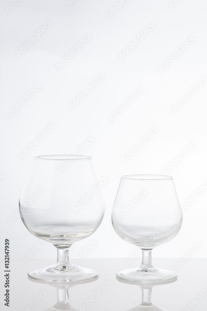 Empty clear short stem wine glasses on a white background Empty clear short stem wine glasses on a white background