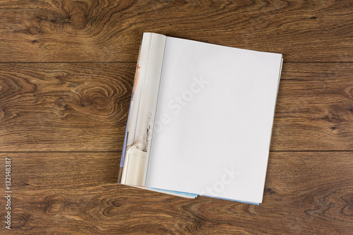 Mock-up magazine or catalog on wooden table. Blank page or notepad on wood background. Blank page or notepad for mockups or simulations.