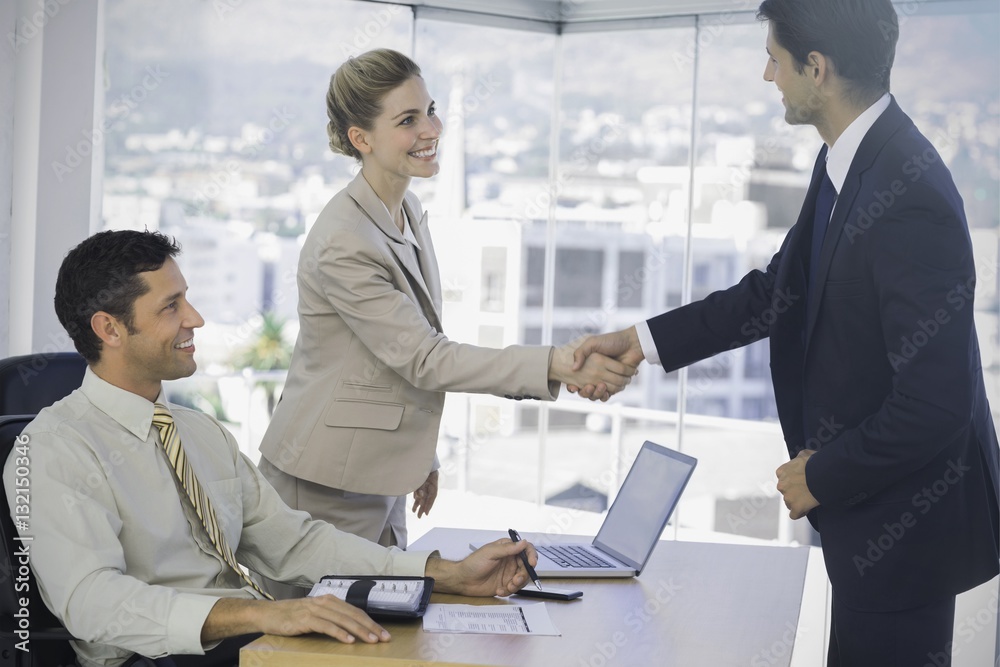 Business people shaking hands with their future patner Business people shaking hands with their future patner
