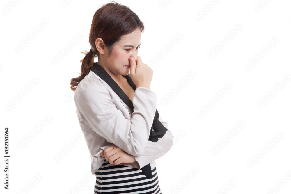 Young Asian woman holding her nose because of a bad smell. Young Asian woman holding her nose because of a bad smell.