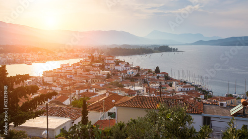 Evening view to Poros island, Greece, Aegean sea. photo