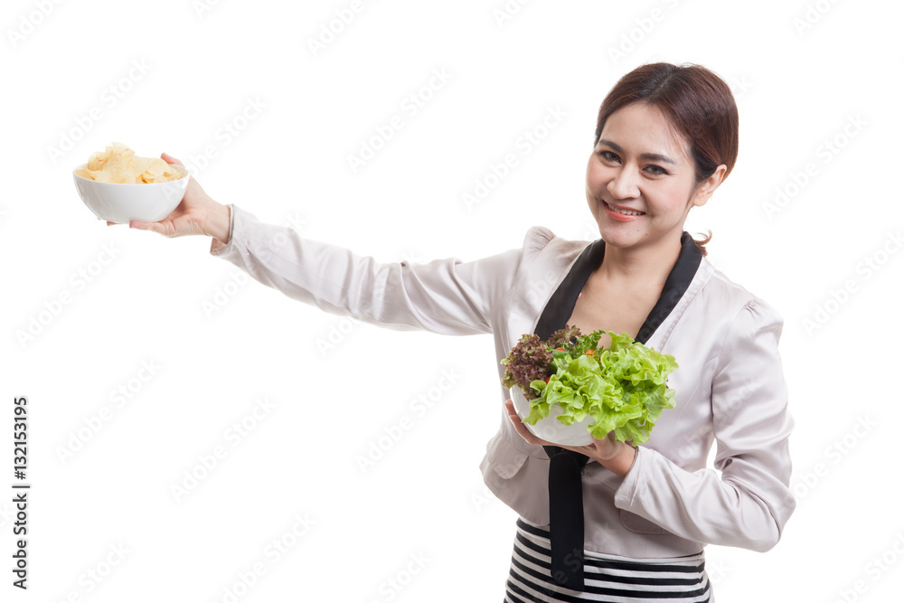 Young Asian business woman with potato chips and salad. Young Asian business woman with potato chips and salad.