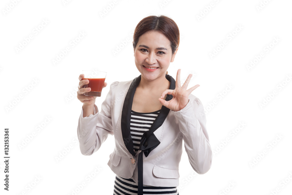Young Asian business woman show OK with tomato juice. Young Asian business woman show OK with tomato juice.