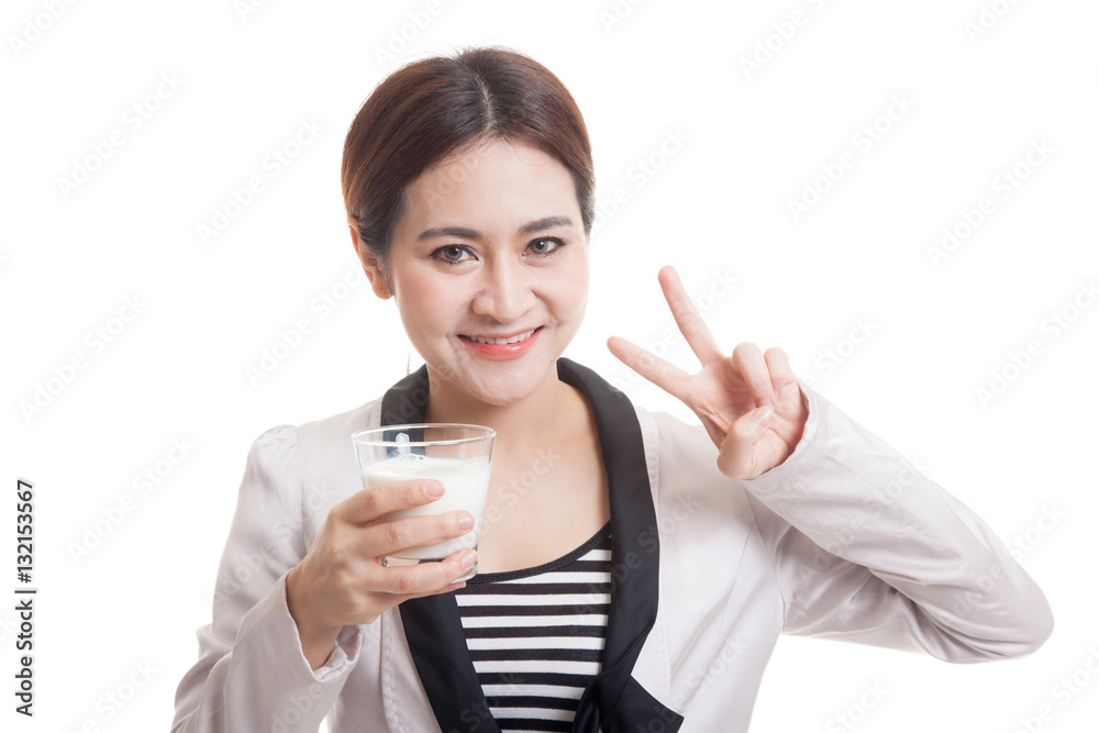 Healthy Asian woman drinking a glass of milk show victory sign. Healthy Asian woman drinking a glass of milk show victory sign.