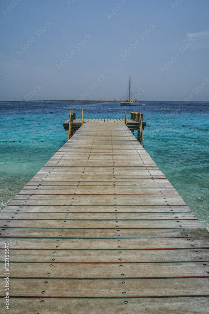 Wooden jetty and blue ocean