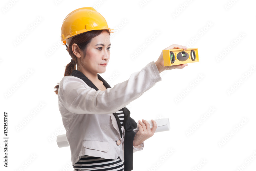 Asian engineer woman with blueprints and level.