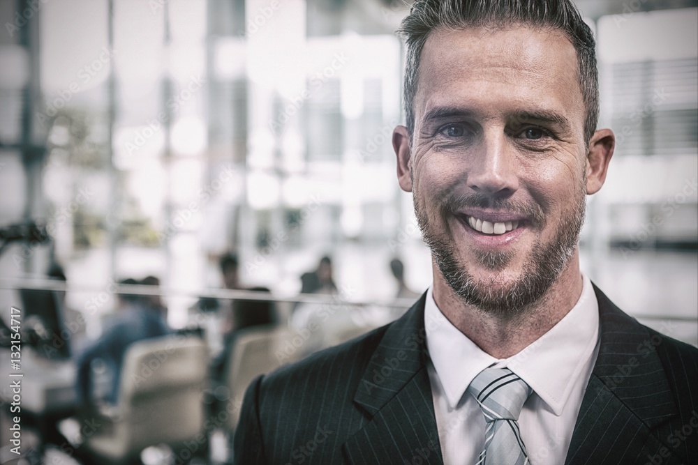 Smiling businessman in office