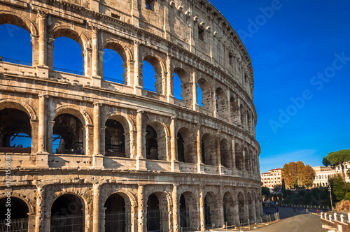 The Colosseum in Rome against splendid blue sky.