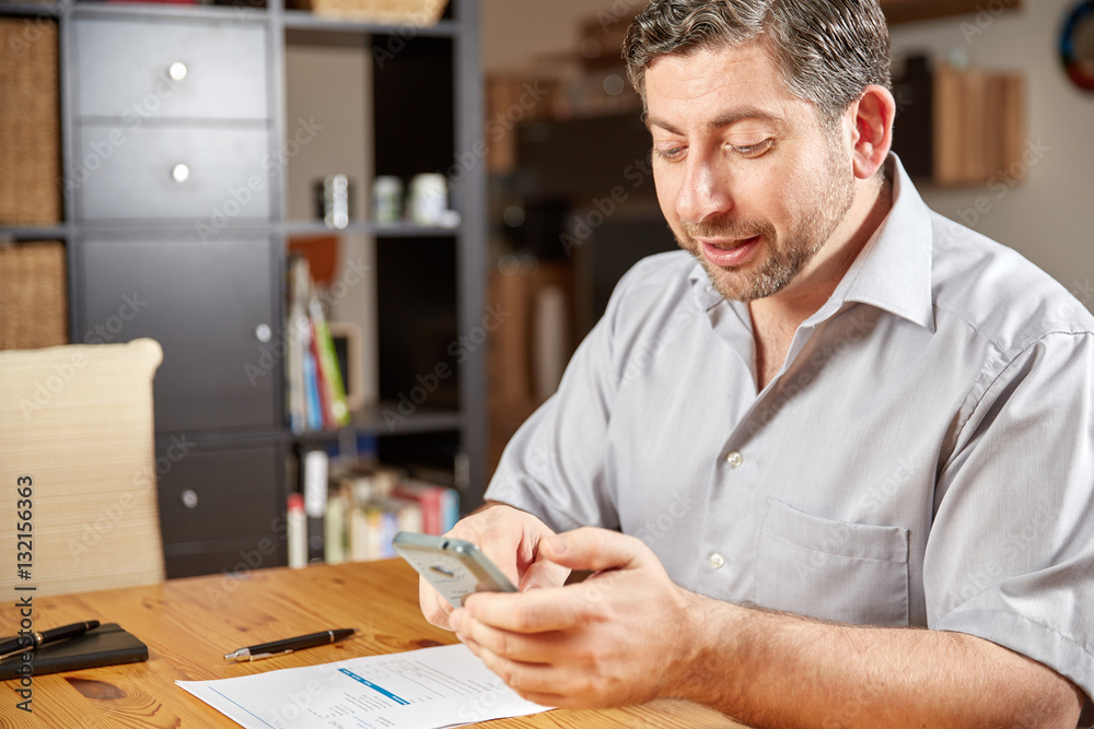 Fototapeta premium Man at home checking online document
