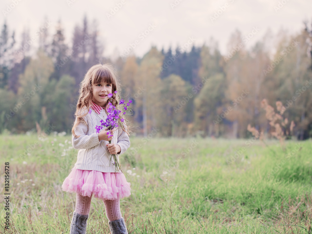 Girl in a field with flowers