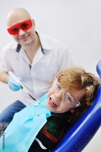 baby boy screaming in the dental chair. Fear of the dentist.