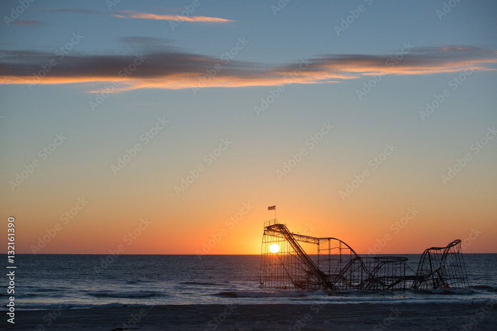 Sunrise behind Star Jet Roller Coaster after Hurricane Sandy 