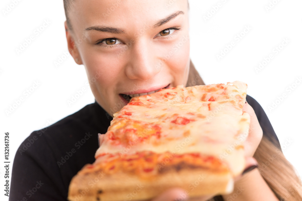 Young woman eat pizza isolated on a white background.