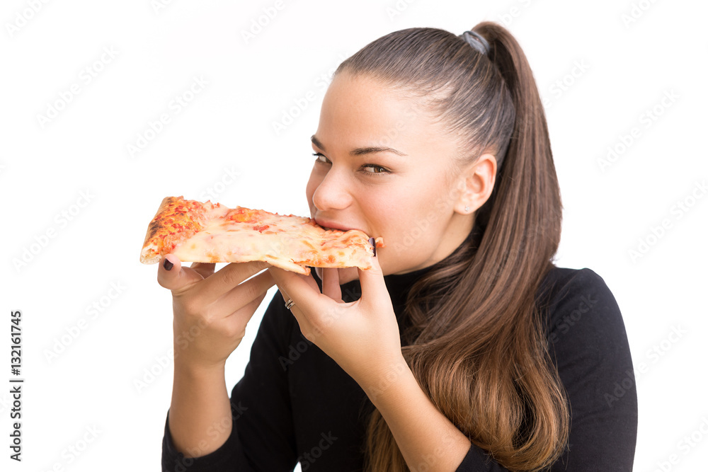 Young woman eat pizza isolated on a white background.