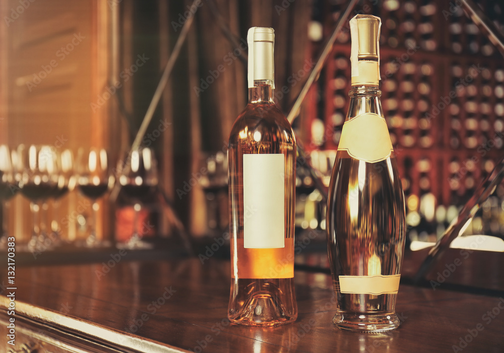 Wine bottles on wooden table at liquor store Wine bottles on wooden table at liquor store