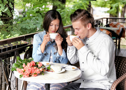 Young couple drinking coffe...
