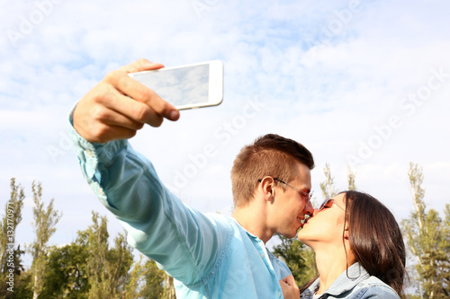 Beautiful young couple taki...