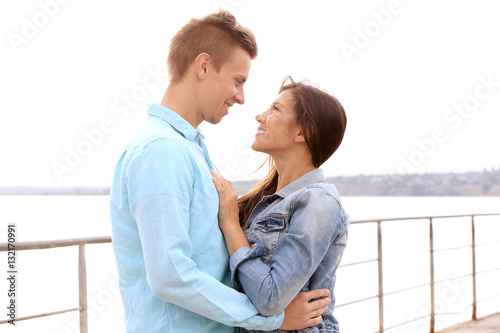 Beautiful young couple near...
