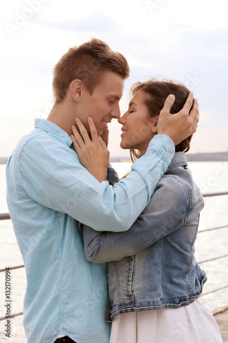 Beautiful young couple near...