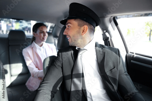 Businesswoman riding a car ...