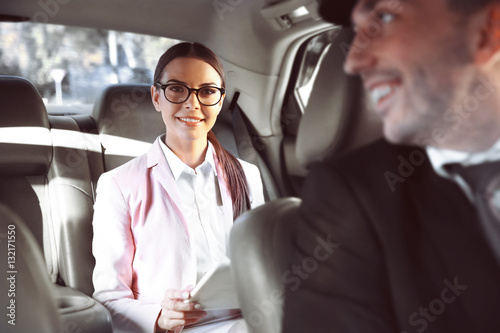 Businesswoman riding a car ...