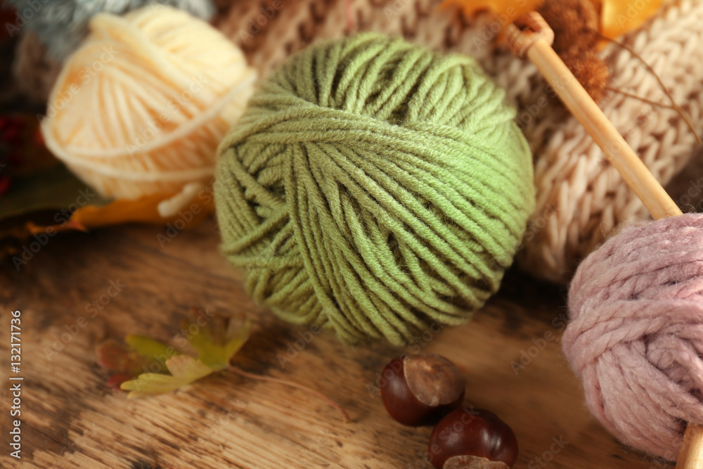 Knitting wool on wooden table Knitting wool on wooden table