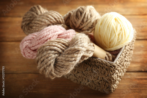 Knitting yarn in box on wooden background