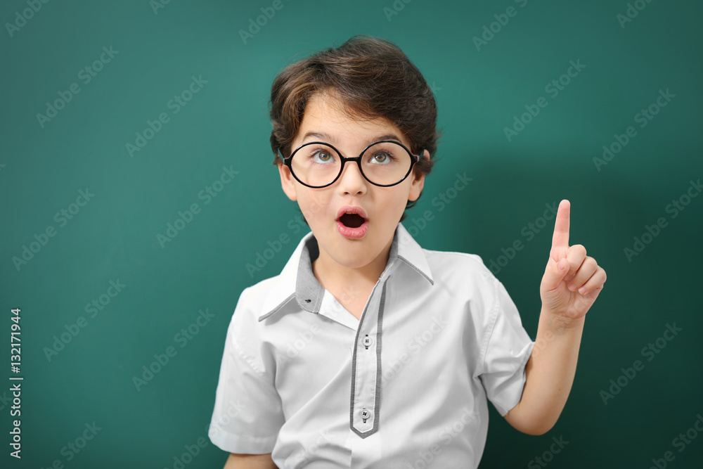 Cute little boy in glasses on green background Cute little boy in glasses on green background
